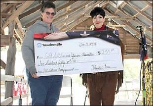 Madison Mahoney | The Rosebud News            Gail Palmore of the Old Settlers Association receives a very generous donation.