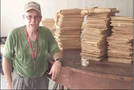 The Rosebud-Lott Lions Club | The Rosebud News            Rosebud-Lott Area Lions Club President, Jim Campbell, standing with a stack of newspapers from The Rosebud News’ back issues.