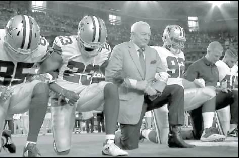 Jerry Jones, owner of the Dallas Cowboys along with Jason Garrett, Head Coach kneel prior to the National Anthem on Monday Night Football. The Cowboys stood and locked arms during the Flag presentation and the Anthem. According to reports, the decision to kneel was a “team decision.”
