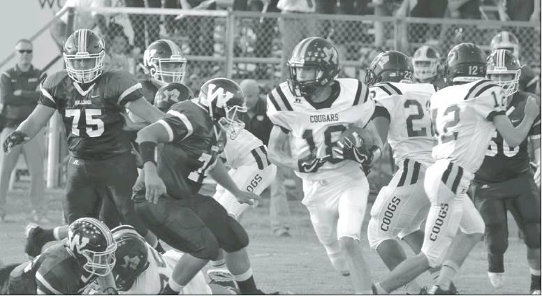 RL Athletic Booster Club | The Rosebud News            Cody Wells making his way around some Wortham Bulldogs with the pigskin tucked tight and on his way to a touchdown.