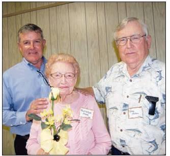 Brothers Justin Wallace(1969) Corpus Christi and Greg Wallace (1966) Rosebud present a yellow rose to their mother Pauline Wallace Grover (1939) Lott at the Golden Years Reunion meeting. Pauline has attended 39 of the 40 Golden Years Reunions. She was the oldest graduate attending this years event.
