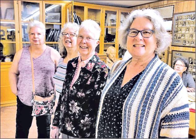 CONTRIBUTED PHOTO            Former Rosebud High School graduates and guests enjoy seeing class pictures of students in Stubb’s Memorial Room during Golden Years Reunion. Pictured from left to right is Doris Downes Mayer, Carolyn Sue Downes Clyde, Suzanne Goad Dansby, and Karyn Kendrick Daily.