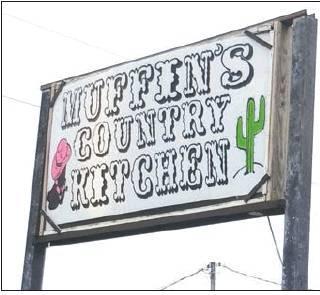 Muffins Country Kitchen sits at 300 U.S. Highway 77 North in Rosebud. Its sign boasts a pink cowgirl hat straddling a pair of boots and a bright green cactus.<br />            Michael Moore photo.