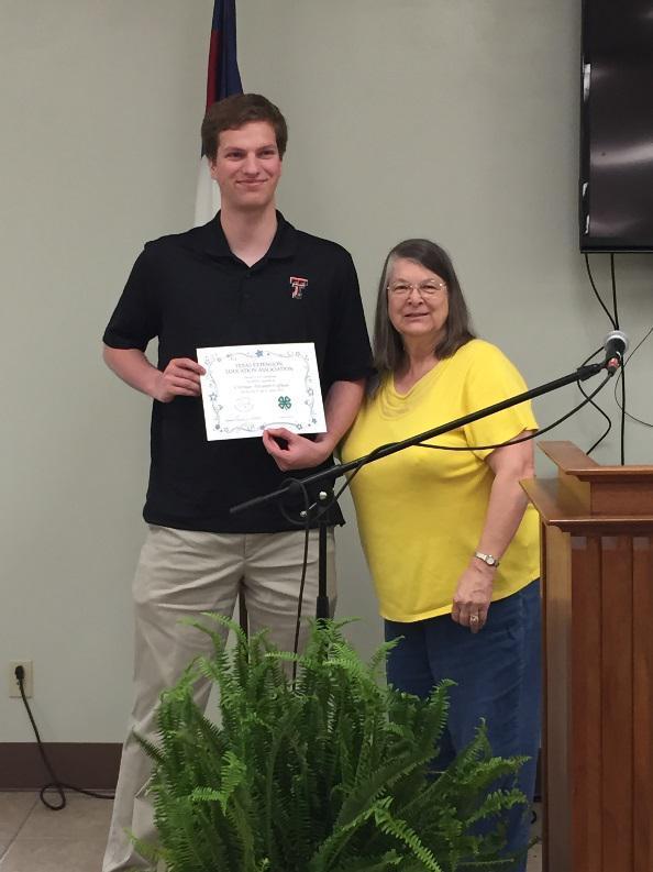 Christian Coffman is awarded a 4-H Scholarship Certificate from Extension Education District 8 Director,  Laurie Veatch following BEEA’s 2019 Luncheon with Style.