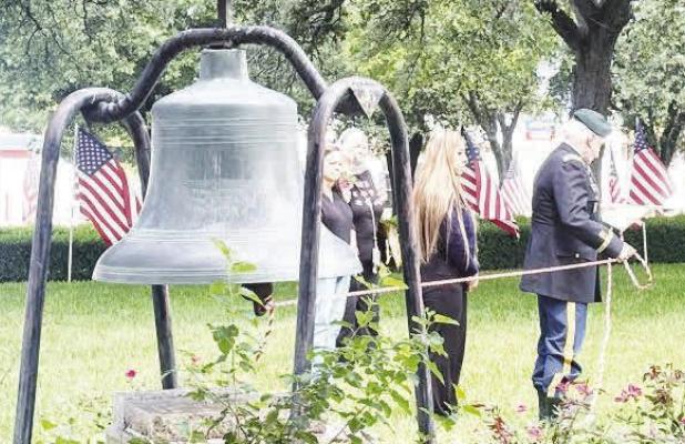 Attendees at the Memorial Day ceremony gathered at the southeast corner of the Falls County Courthouse grounds for the ringing of the historic bell. Photo by Mark Pelzel