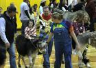 Jentry Moeller enjoys a Donkey Ride during half time at the Rosebud-Lott I.S.D. annual Donkey Basketball Game